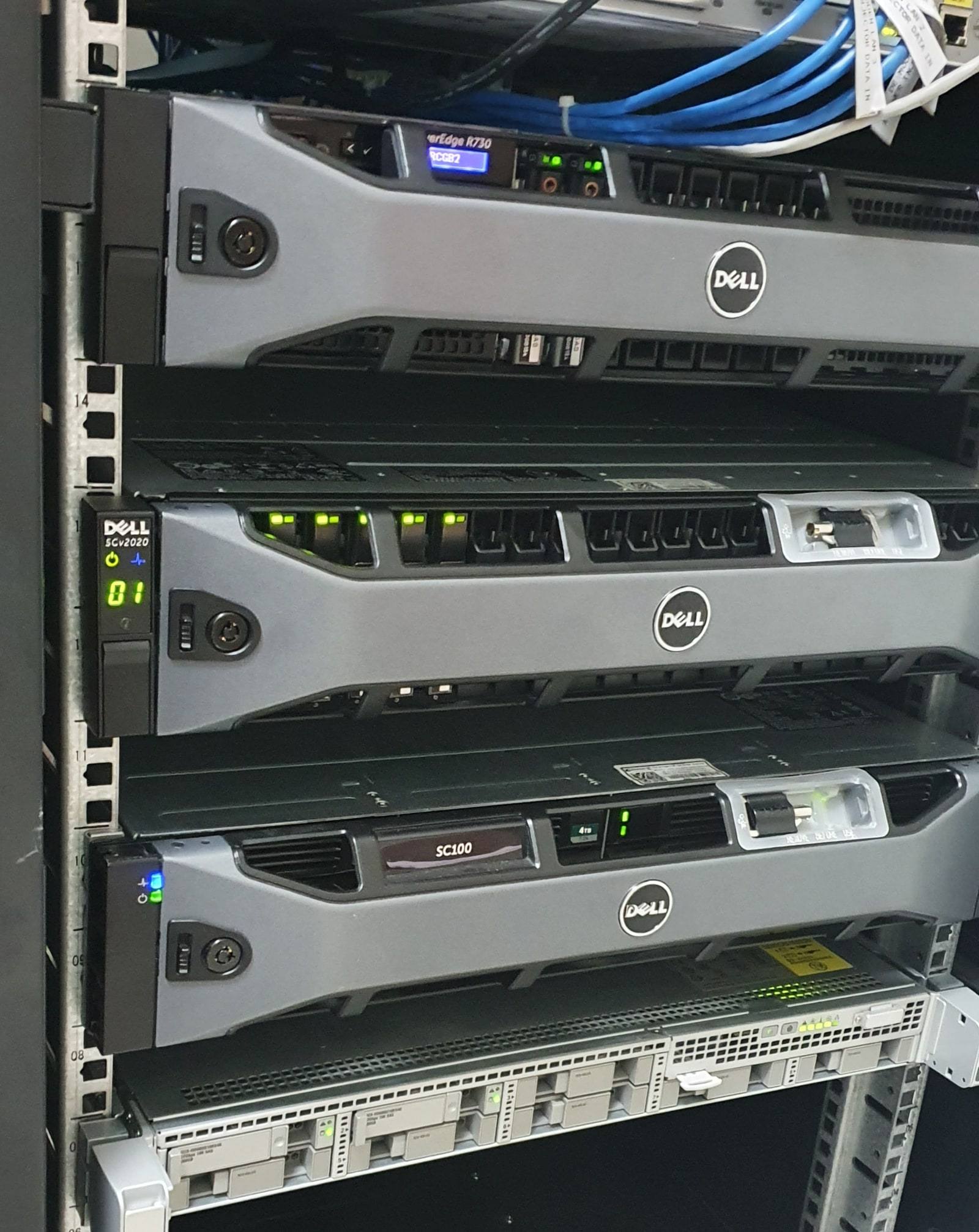 Rack with Dell PowerEdge servers, Dell storage arrays and a Cisco rack server.